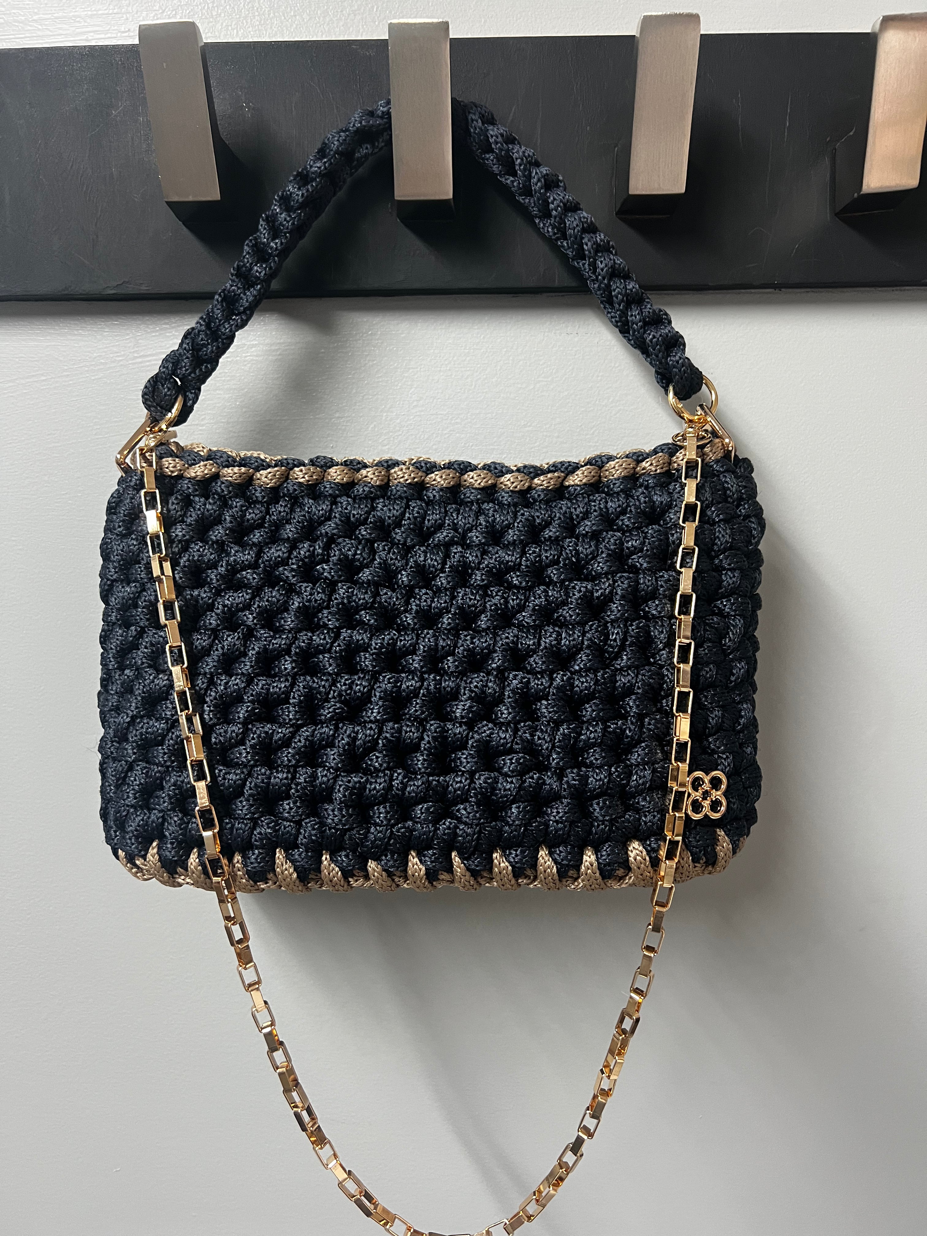 Navy woven handbag with taupe trim and gold chain